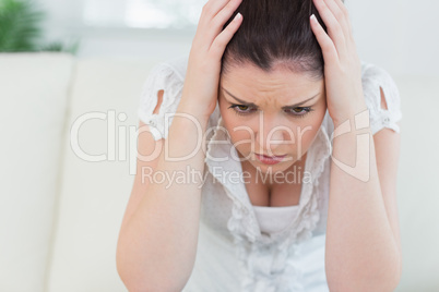 Annoyed woman sitting on the couch