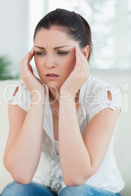 Stressed woman sitting on the couch