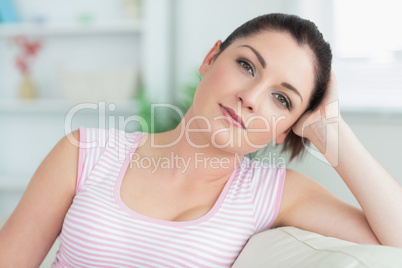 Woman sitting on a couch in a living room