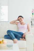 Relaxing woman sitting on a couch