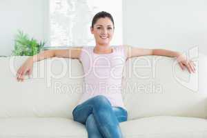 Smiling woman on a couch
