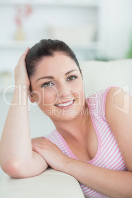 Lying woman on the couch in a living room