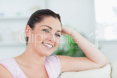 Woman relaxing while being on the couch