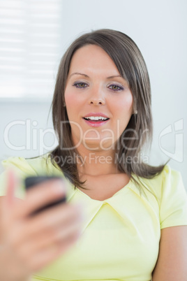 Woman looking at her smartphone