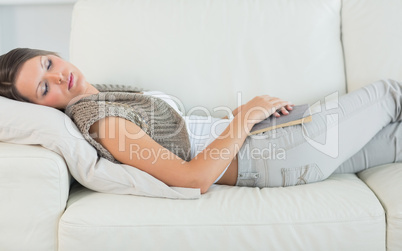 Woman lying on sofa and sleeping