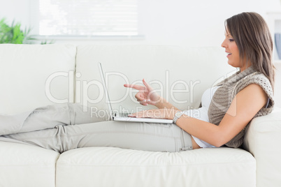 Woman using video chat on laptop