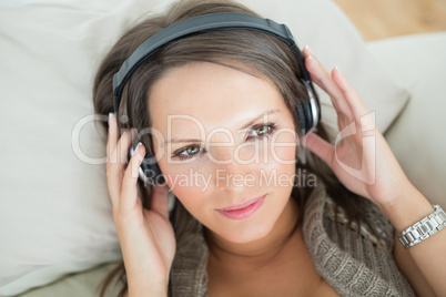 Smiling woman listening to music