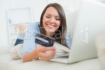 Woman shopping online and smiling