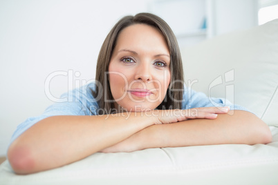 Brunette lying on couch