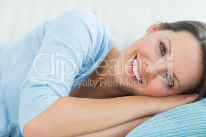 smiling woman lying down