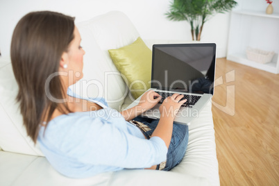 Woman typing on her laptop