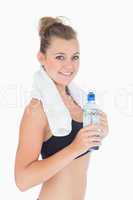 Woman smiling while holding a bottle