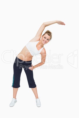 Woman standing and stretching arms Woman standing and stretching arms