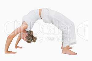 Girl in upward bow yoga pose