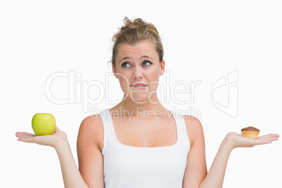 Woman deciding to eat healthy or not