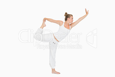 Girl in lord of the dance yoga pose