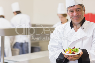 Chef presenting his salad