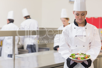 Chef presenting her salad