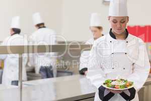Chef presenting her salad