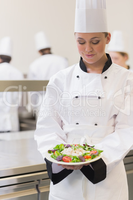 Chef looking at her salad