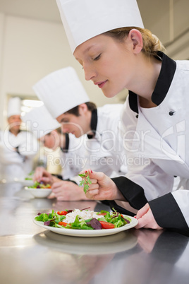 Chef preparing a salad in class