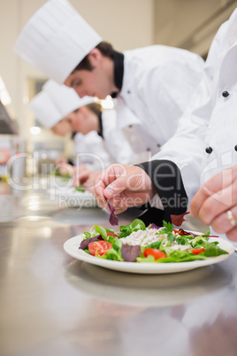 Salad being garnished