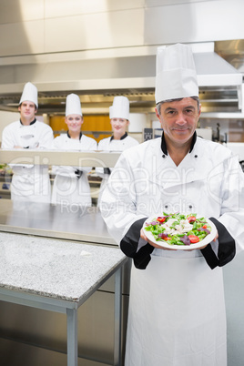 Head chef showing a salad