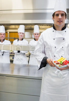 Chef presenting fruit salad