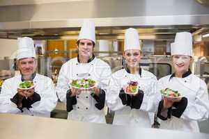 Chef's presenting different salads