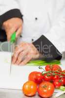 Chef chopping spring onions