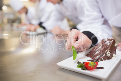 Chocolate cake being garnished