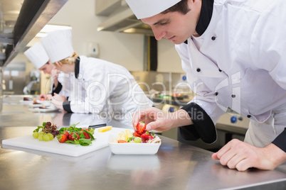 Chef preparing a fruit salad