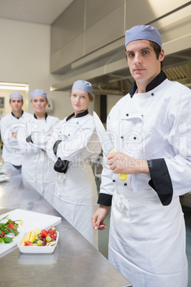 Chef looking stern holding a knife