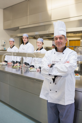 Head chef standing with arms crossed