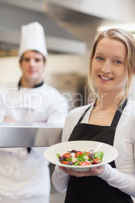 Waitress presenting a salad