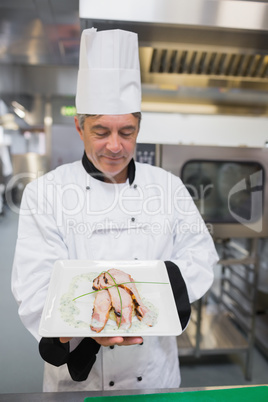 Chef looking at his dish