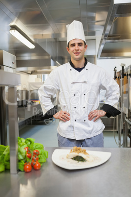 Chef standing behind his dish