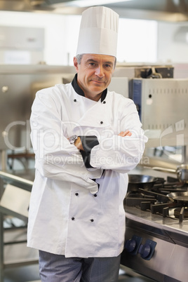 Chef leaning at the stove