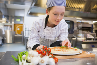 Woman preparing pizza