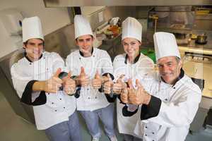 Team of Chef's giving thumbs up
