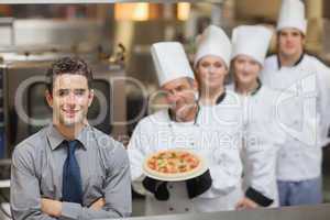 Waiter standing in front of Chef's