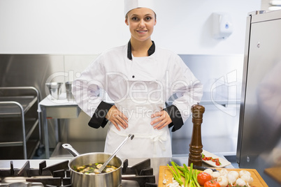 Chef standing at stove making soup