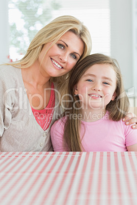 Mother and daughter at kitchen table