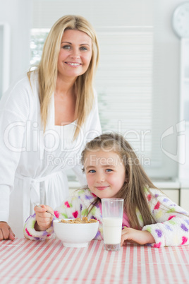 Girl having cereal for breakfast