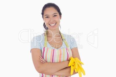 Woman smiling and holding rubber gloves