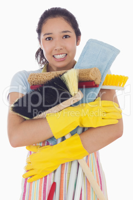 Woman nearly dropping her cleaning tools
