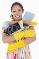 Woman nearly dropping her cleaning tools