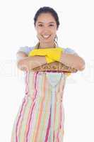 Smiling woman leaning on mop
