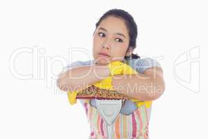 Bored woman leaning on a mop