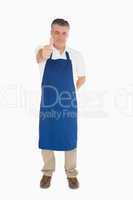 Man in apron giving thumbs up